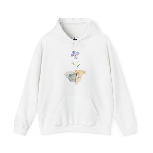 White hoodie with watercolor design of a purple flower growing from cracked stone.