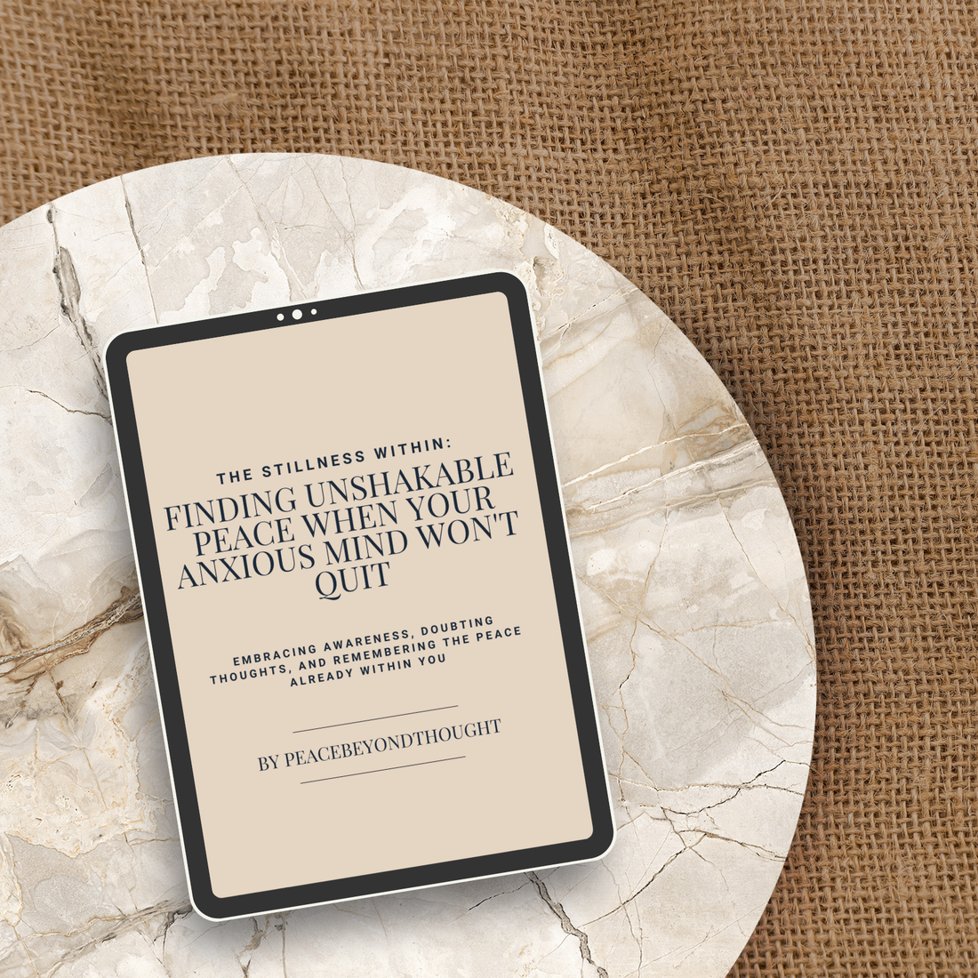 Spiritual eBook tablet mockup on marble and burlap, titled The Stillness Within