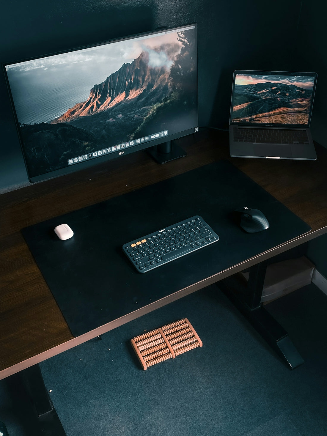 a desk with a keyboard, mouse and monitor on it