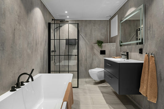 A bathroom with a large bathtub next to a toilet