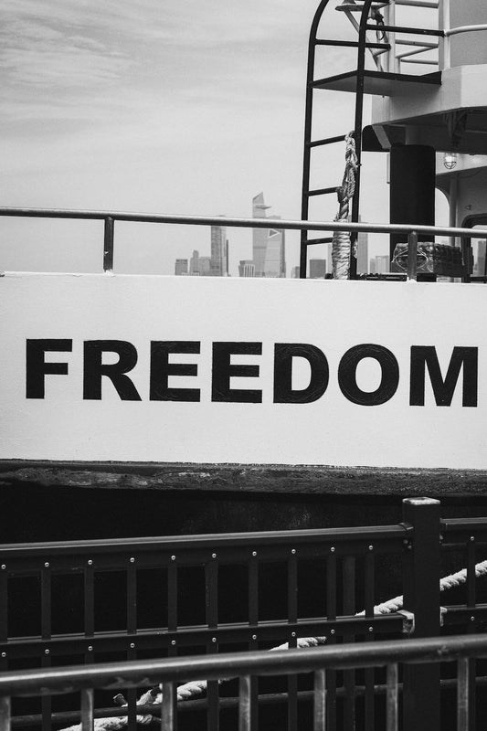 The word freedom is seen on a boat.