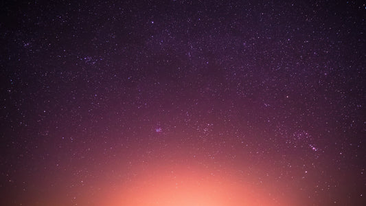 Starry night sky fading into warm horizon — symbolizing awareness beyond thought, silence, and God’s presence | PeaceBeyondThought Blog