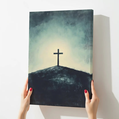 Christian cross canvas art on a hill, serene spiritual wall decor, held by hands