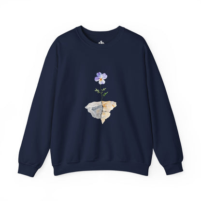 Navy blue sweatshirt with a purple flower growing through rocks graphic, mindful Christian apparel