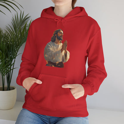 Woman wearing red hoodie with praying Jesus graphic, Christian faith apparel