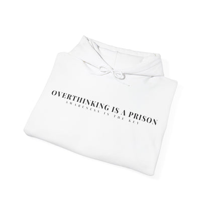 Folded white hoodie with motivational text 'Overthinking is a prison, awareness is the key'.