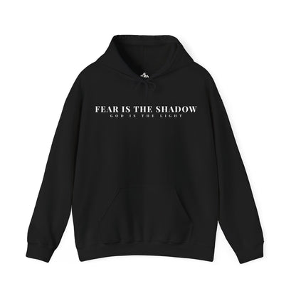 Black Christian hoodie with 'Fear is the shadow, God is the light' white text, spiritual apparel