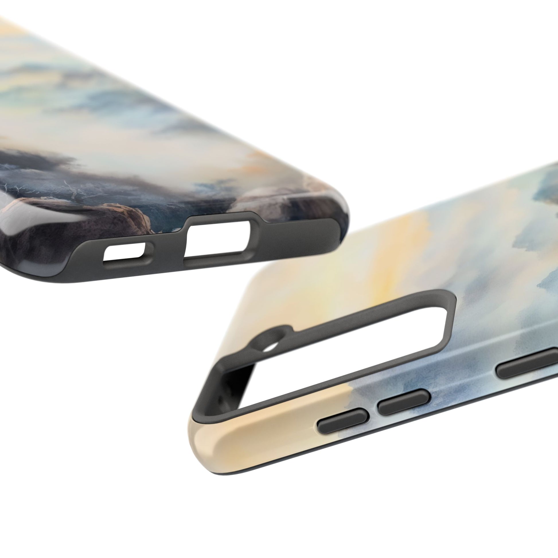 Close-up of phone cases with abstract pastel sky and mountain landscape design