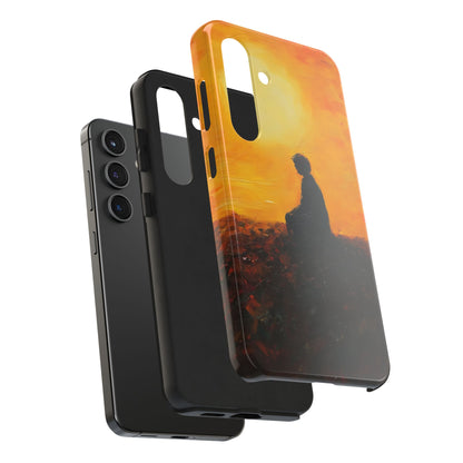 Phone case with contemplative silhouette against orange sunset, spiritual art design