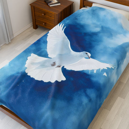 White Dove Blue Watercolor Velveteen Plush Blanket — blanket draped across bedding