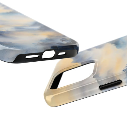 Abstract watercolor phone cases with soft blue and yellow sky-inspired design, close-up view.
