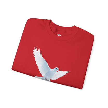 Folded red Christian t-shirt with white dove graphic, faith-inspired apparel