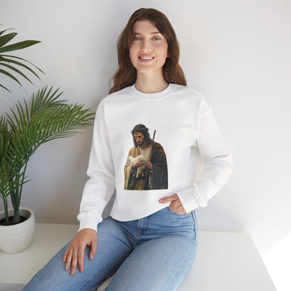 Woman in white Christian sweatshirt with Jesus and lamb graphic, sitting by green plant