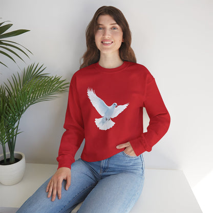 Woman in red sweatshirt with white dove graphic, sitting by a green potted plant