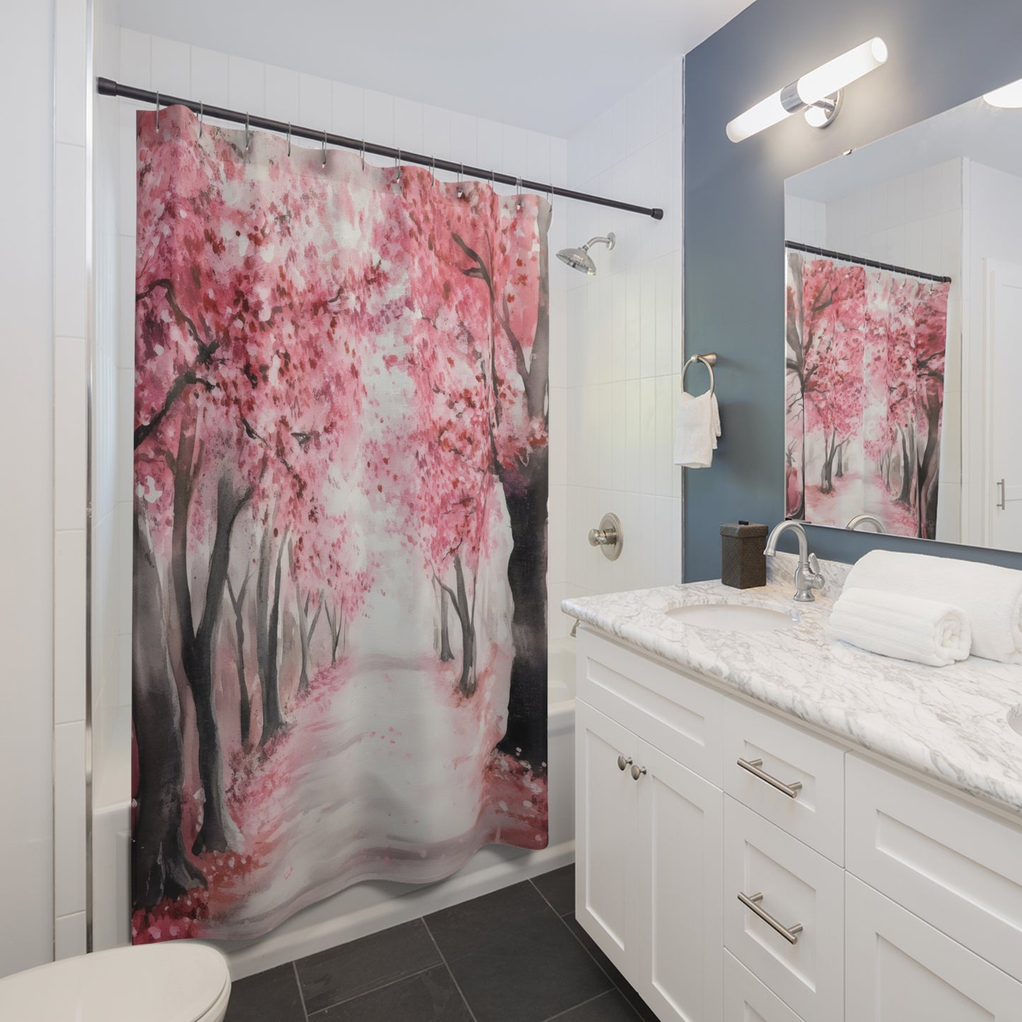 Bathroom with white vanity and pink floral shower curtain featuring cherry blossom trees.