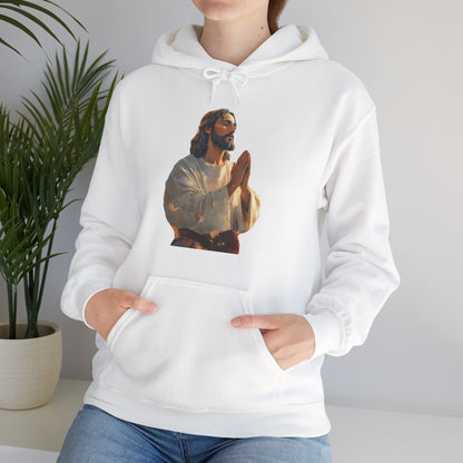 White hoodie with praying Jesus graphic, Christian apparel, worn by woman indoors with plant