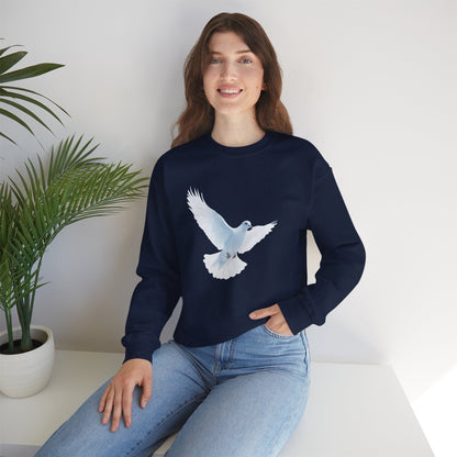 Woman wearing navy Christian sweatshirt with white dove graphic, sitting indoors by plant