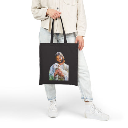 Black tote bag with illustration of Jesus holding a lamb, faith-inspired Christian accessory