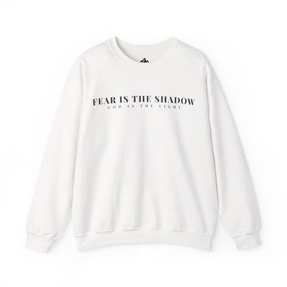 White Christian sweatshirt with 'Fear Is The Shadow, God Is The Light' spiritual quote print