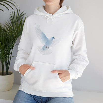 White hoodie with a peaceful dove graphic, worn by woman in bright indoor setting