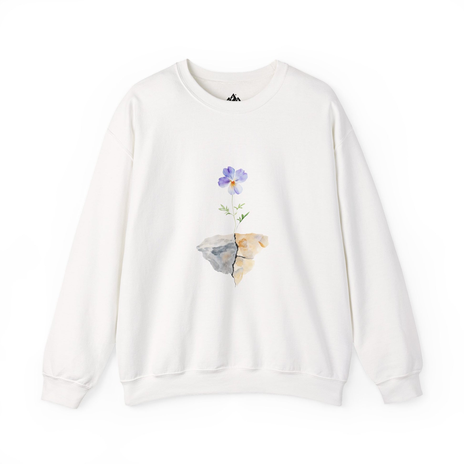 White sweatshirt featuring a purple flower growing from a cracked rock graphic, faith-inspired design