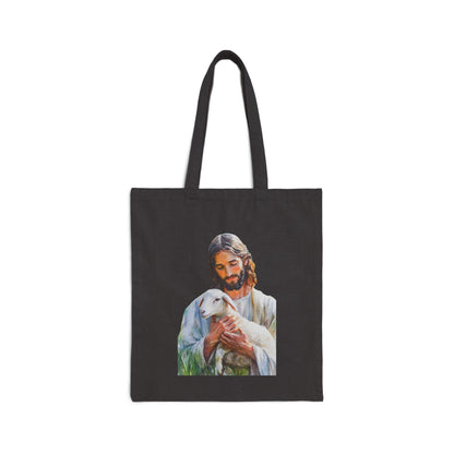 Black tote bag with serene illustration of Jesus holding a lamb, faith-inspired Christian accessory