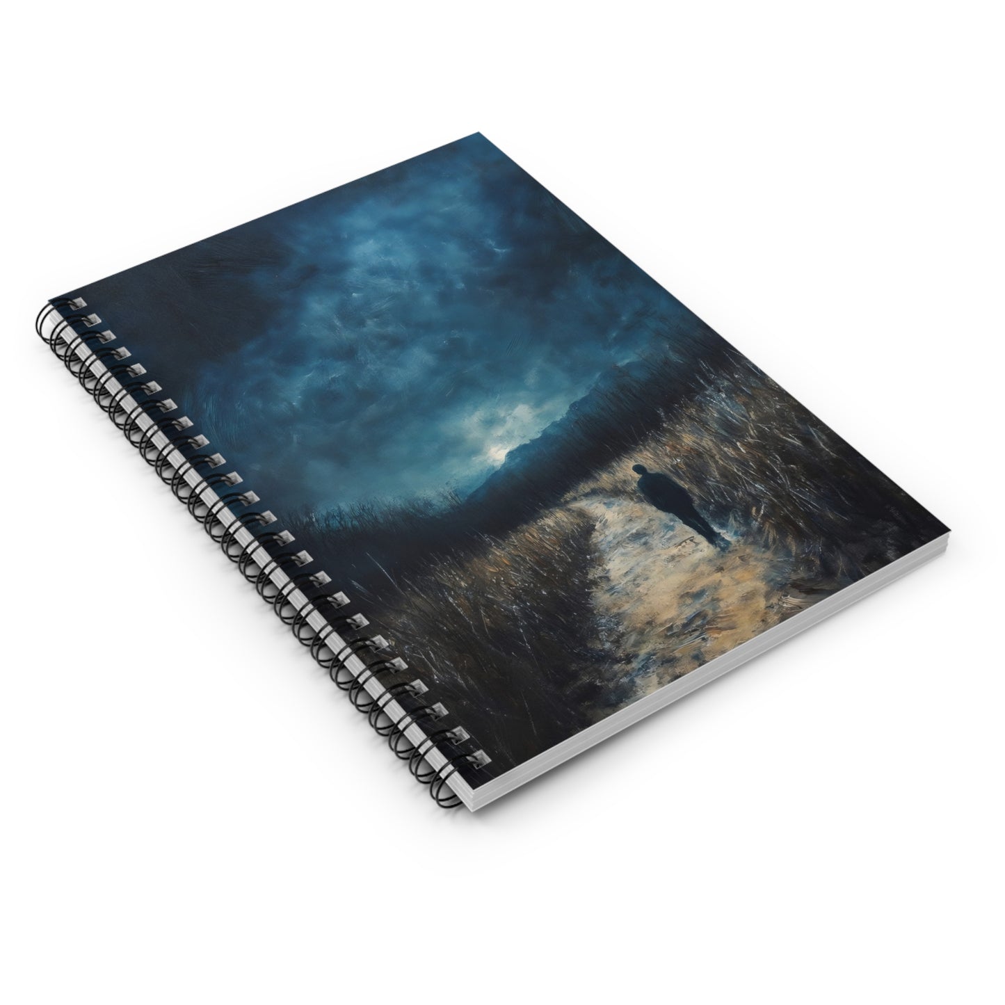 Spiral notebook with a cover art of a figure walking a path under a dramatic blue sky