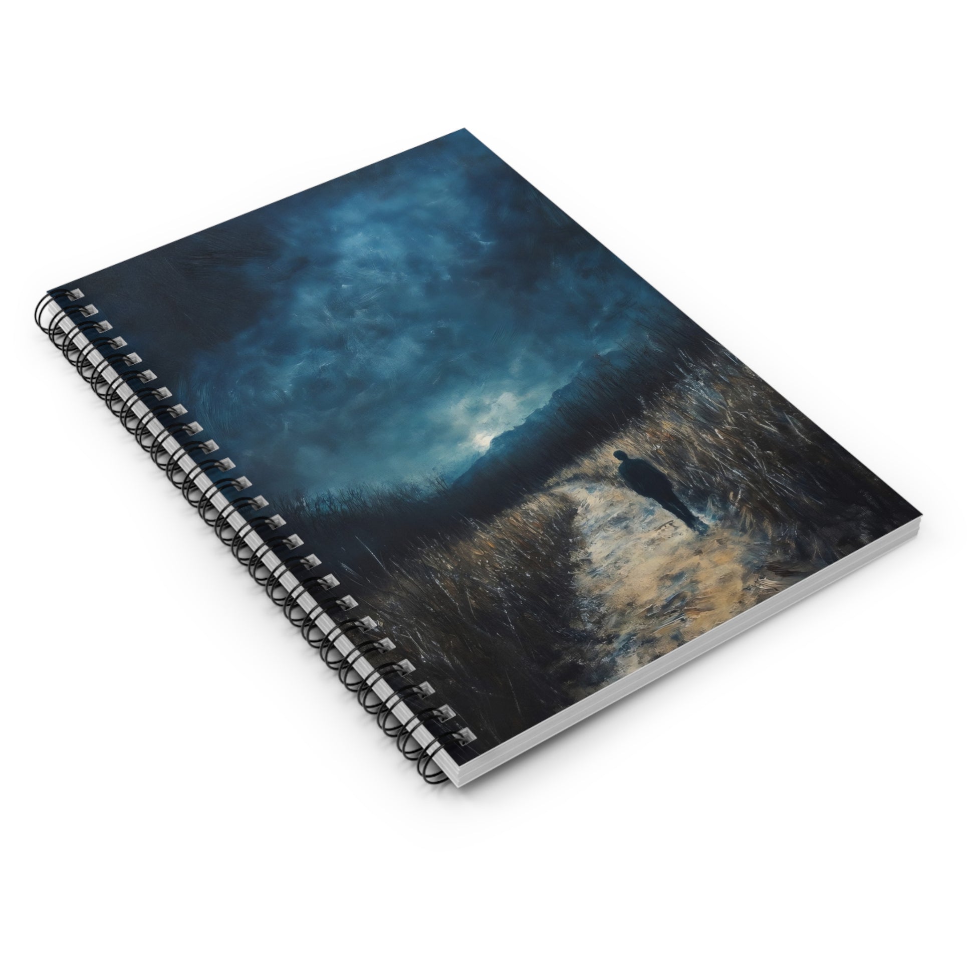 Spiral notebook with a cover art of a figure walking a path under a dramatic blue sky