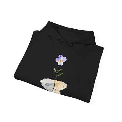 Black hoodie with a watercolor purple flower growing from a cracked stone, spiritual apparel