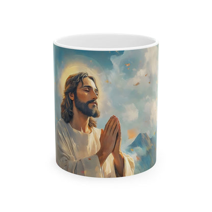 Christian mug featuring serene painting of Jesus praying with folded hands and halo, sky background