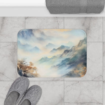 Bathroom floor mat with a serene mountain and mist watercolor design, next to slippers and towel