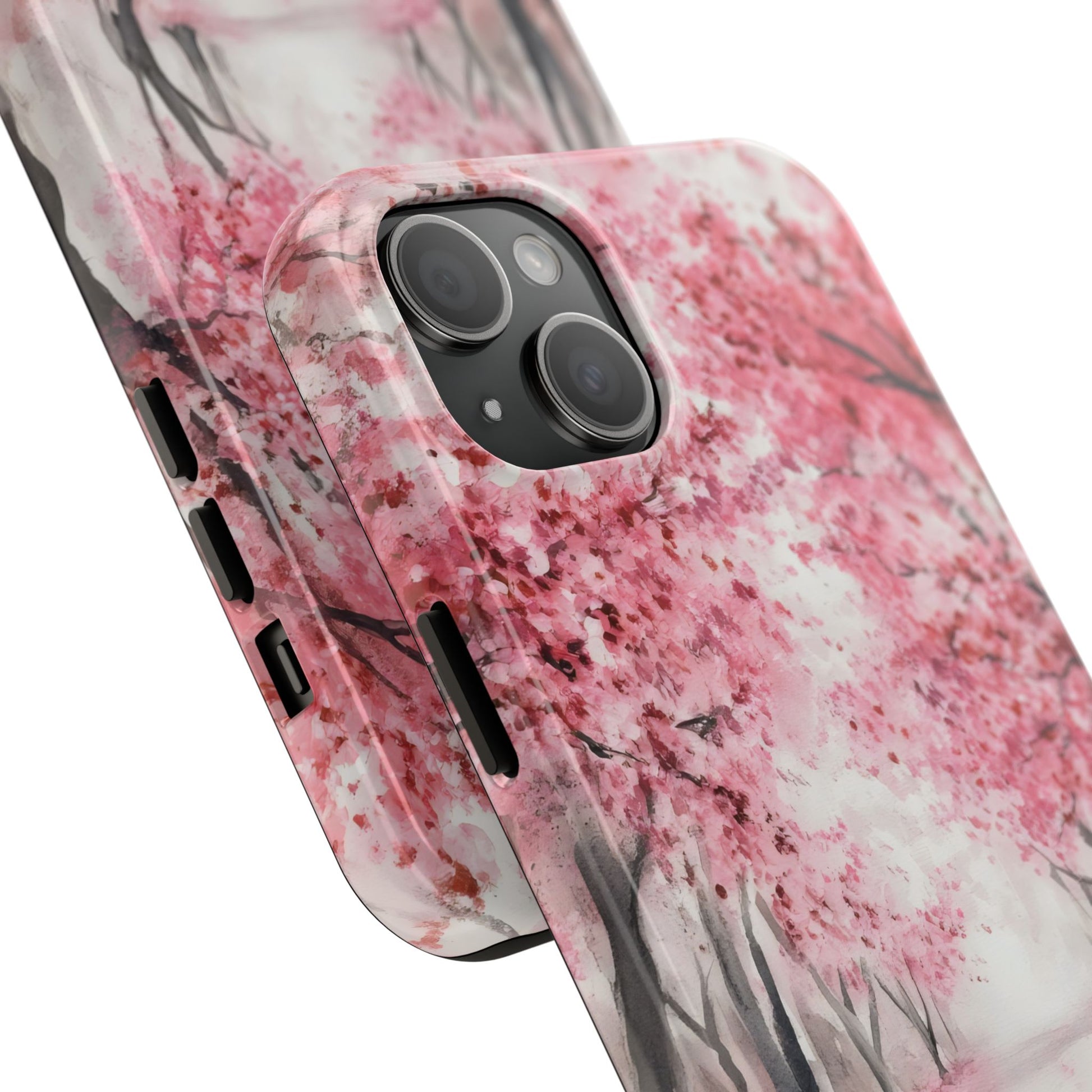 Phone case with pink cherry blossom floral design, close-up on camera cutout