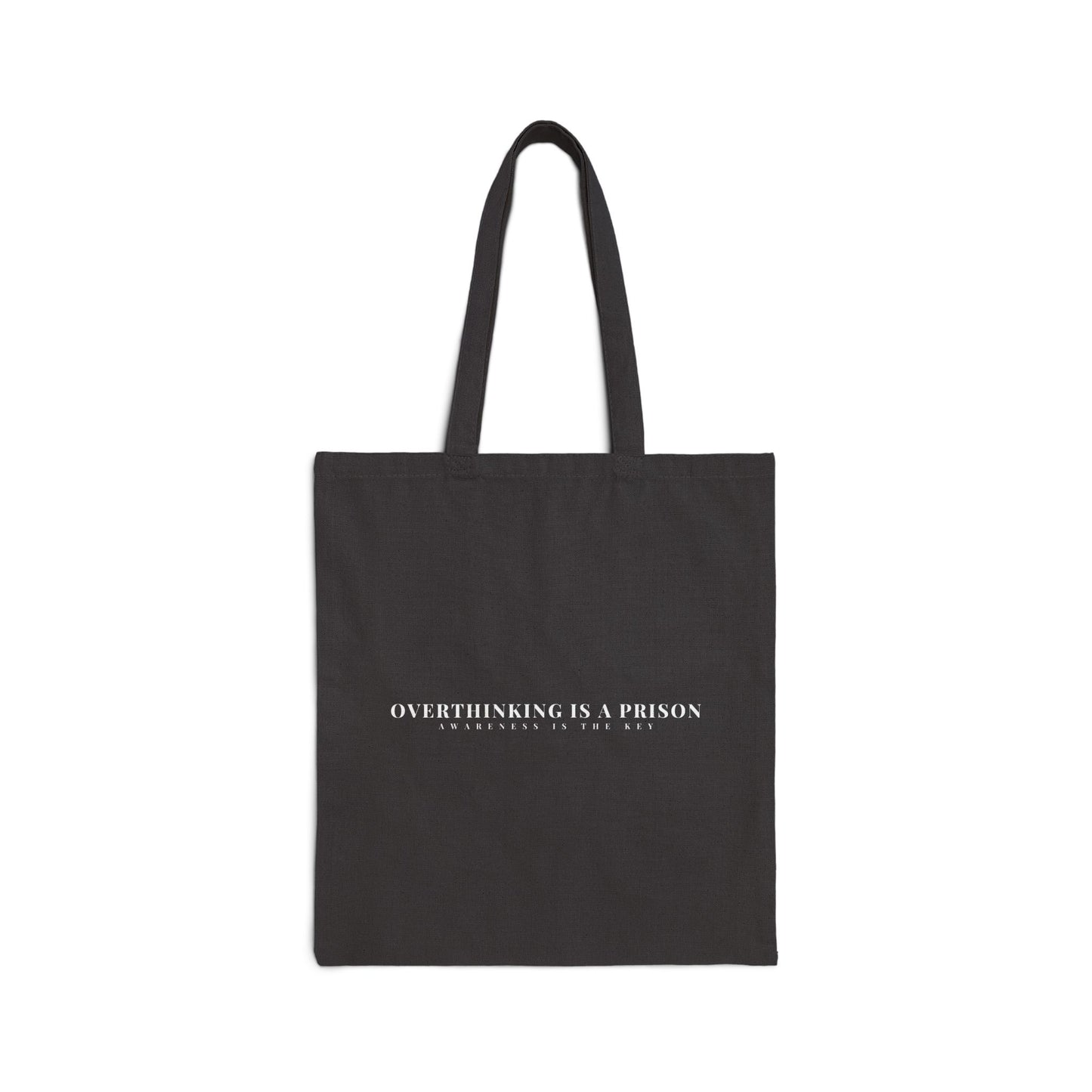 Black tote bag with white text saying 'Overthinking is a prison, awareness is the key'