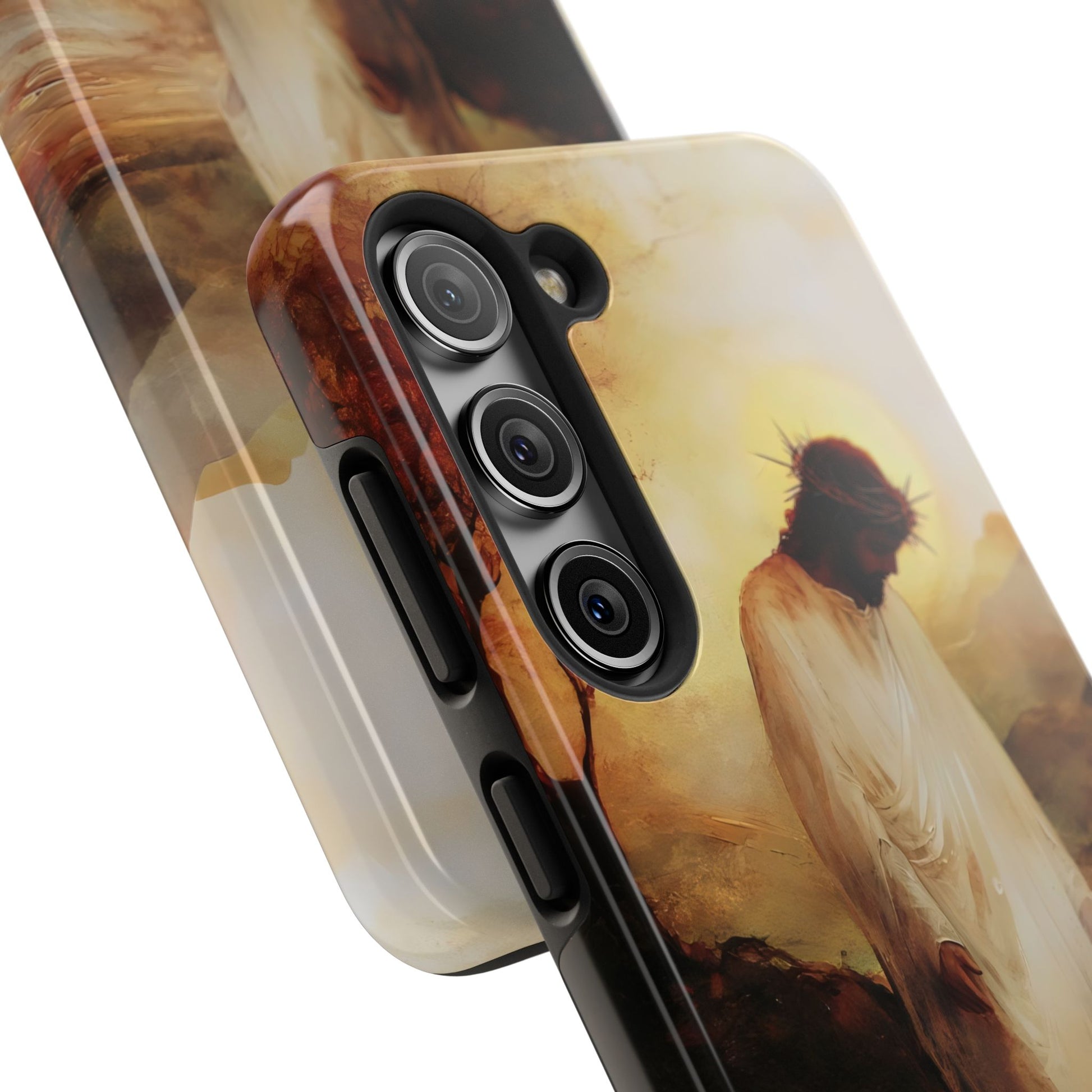 Close-up of phone case with artistic depiction of Jesus wearing crown of thorns in soft light