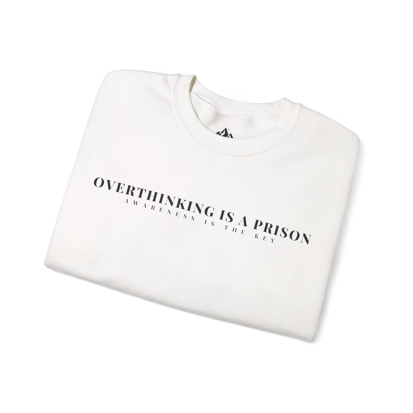 White folded sweatshirt with 'Overthinking is a Prison Awareness is the Key' minimalist text design