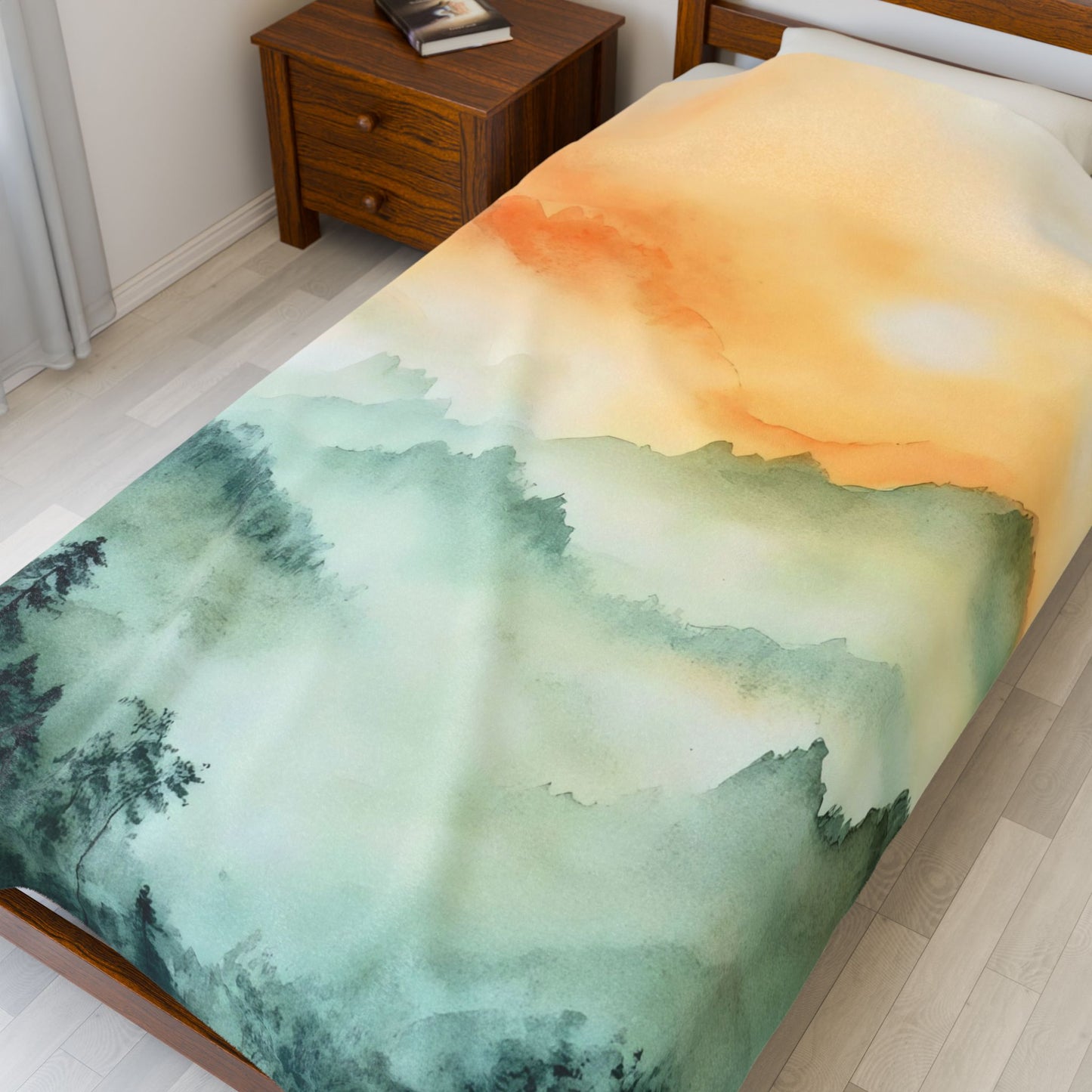Watercolor landscape duvet cover with orange sunset and green mountain design on bed