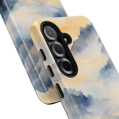 Phone case with serene watercolor landscape in soft blue and beige tones, misty mountain design