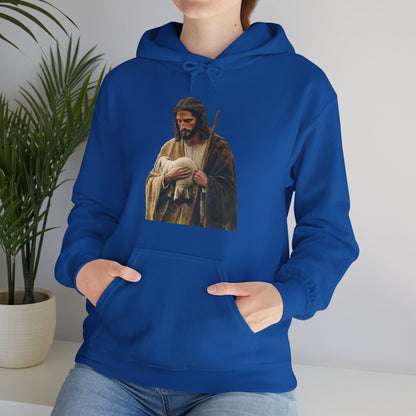 Woman wearing royal blue hoodie with shepherd and lamb Christian art print