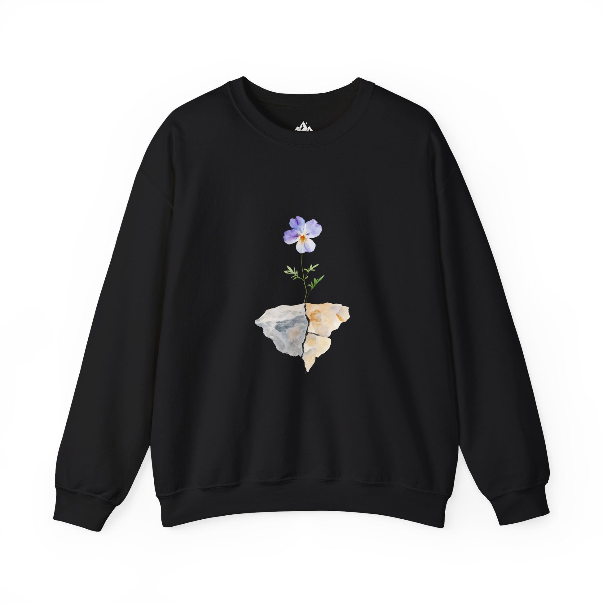 Black crewneck sweatshirt with a purple flower growing from cracked rocks, minimalist design