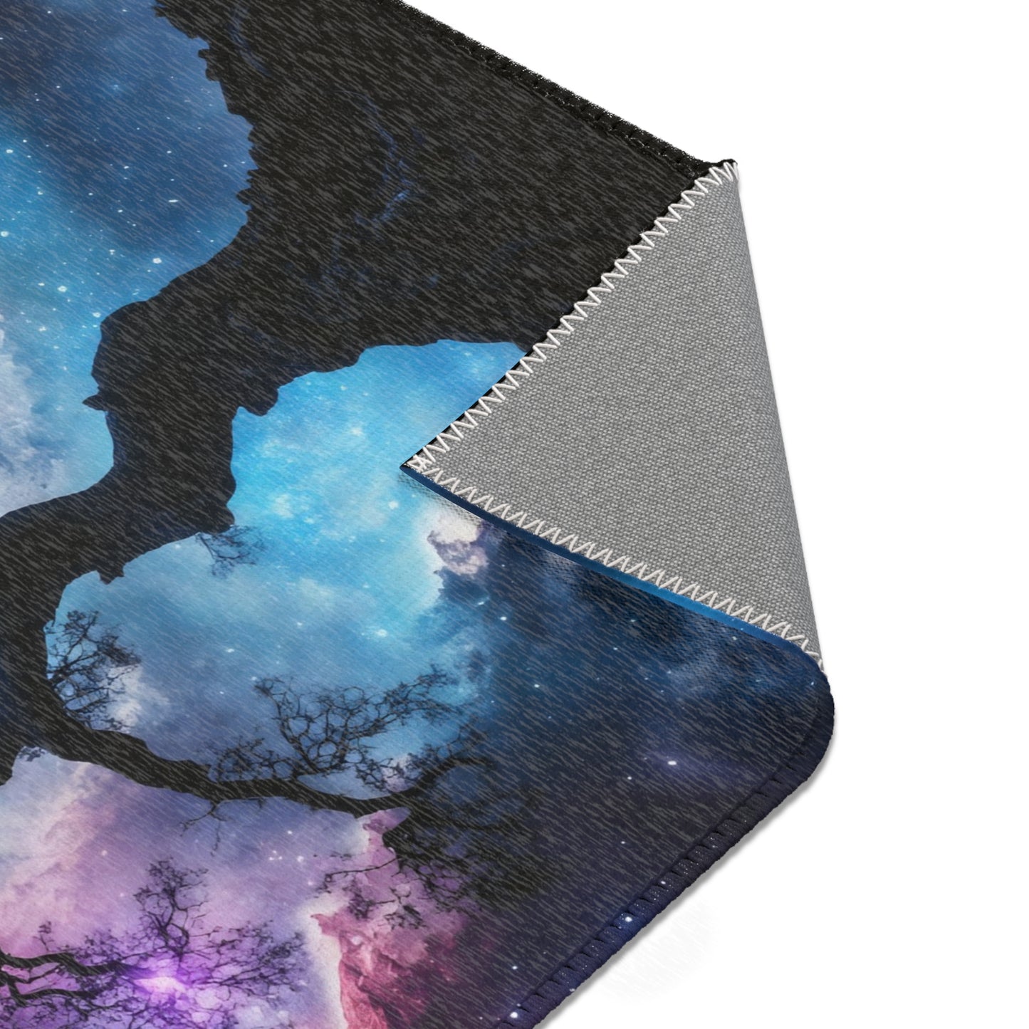 Soft blanket with galaxy sky, tree silhouettes, and vibrant mystical colors
