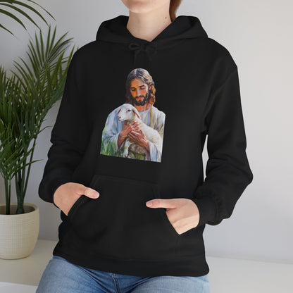 Woman wearing black hoodie with Jesus holding a lamb graphic, Christian faith apparel