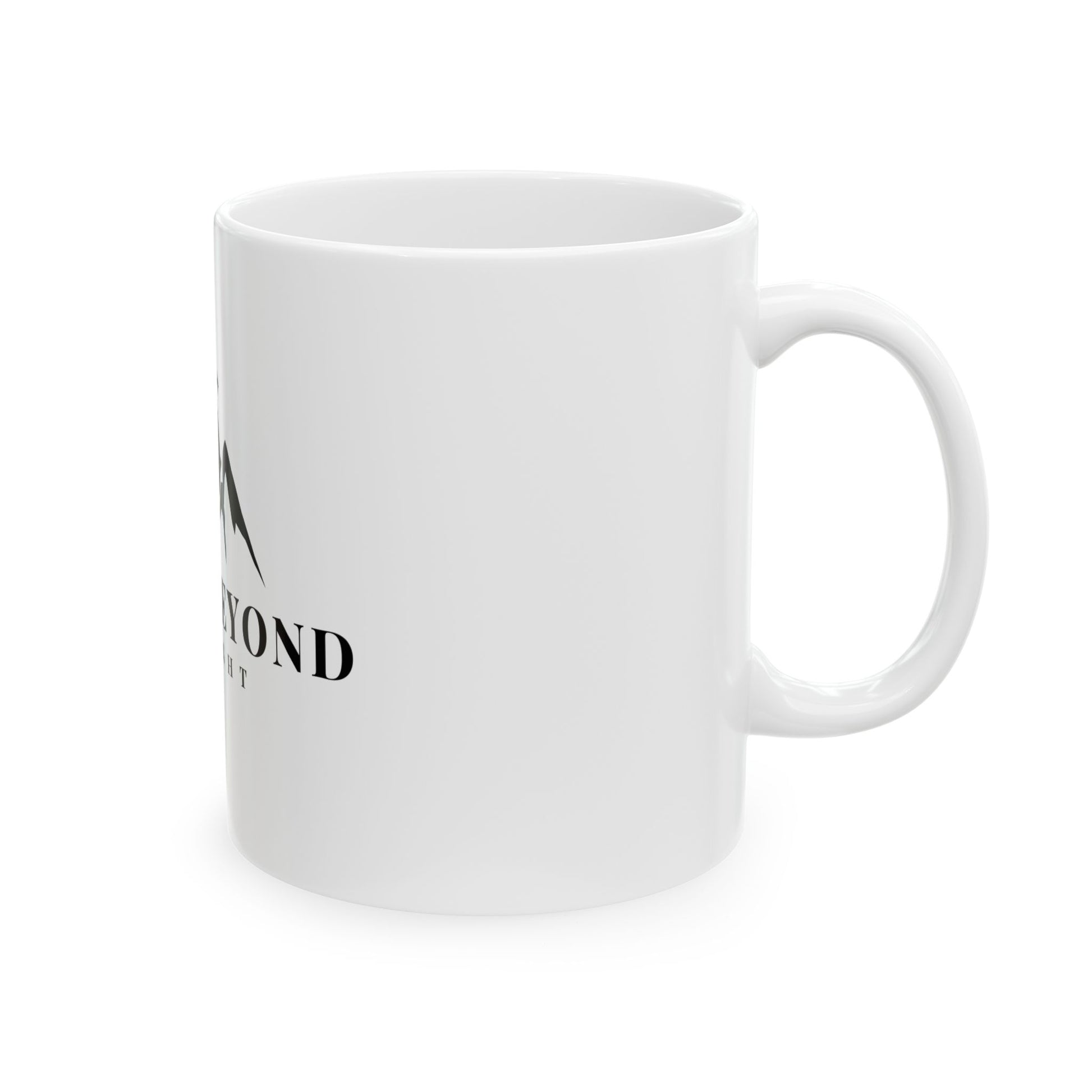 White ceramic mug with partial spiritual mountain design and minimal black text
