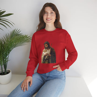 Woman in red Christian sweatshirt with Jesus and lamb graphic, sitting by indoor plant