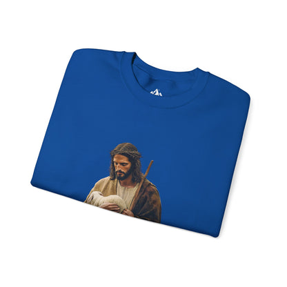 Blue Christian sweatshirt with artwork of Jesus holding a lamb, faith-inspired apparel
