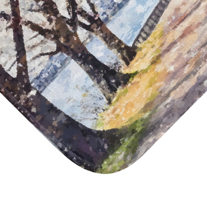 Watercolor-style wall art showing trees by a lake with soft, calming colors