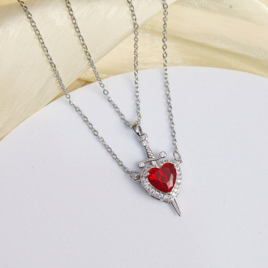 Red heart pendant with arrow and gold-tone chain