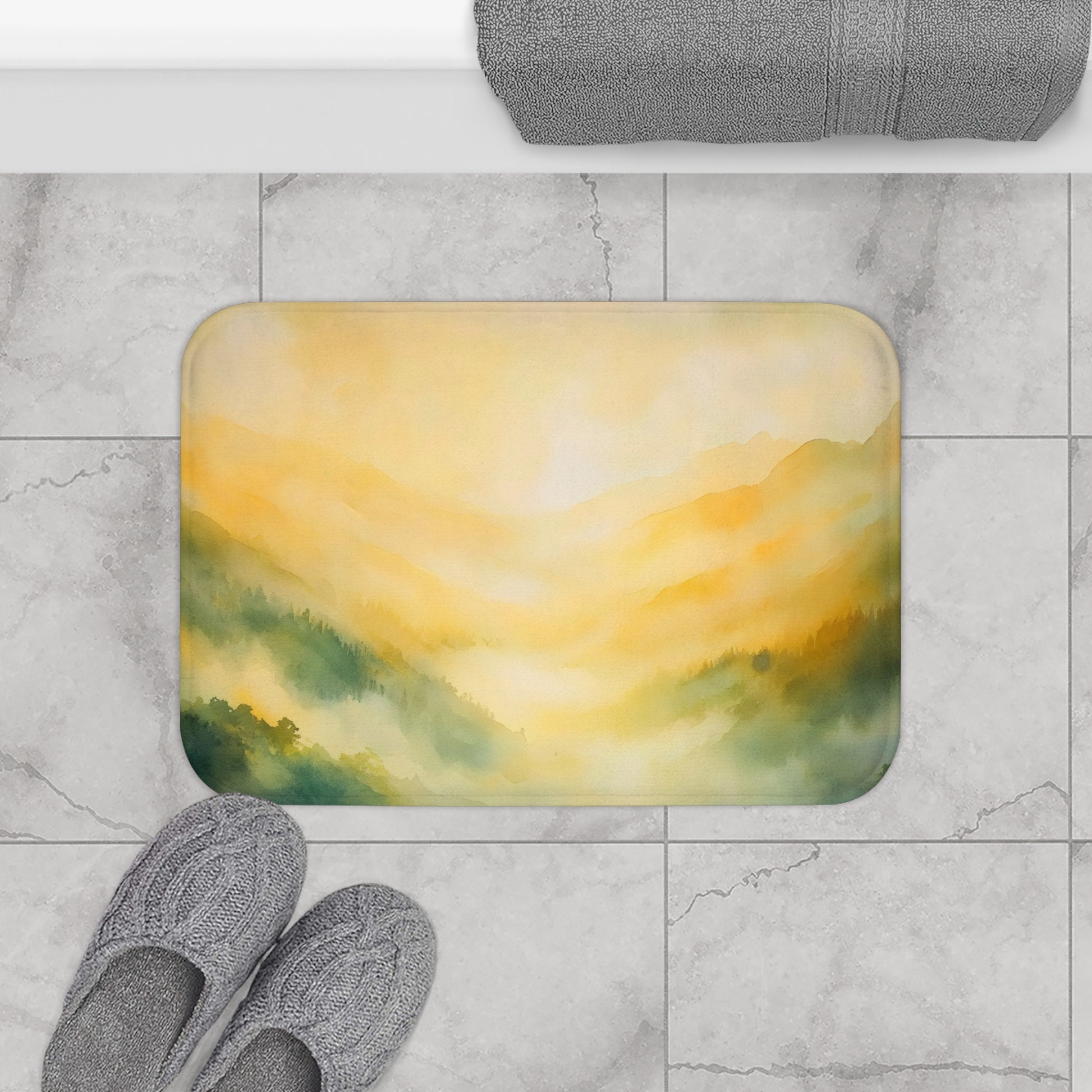 Bathroom floor mat with yellow and green watercolor mountain landscape design on tile