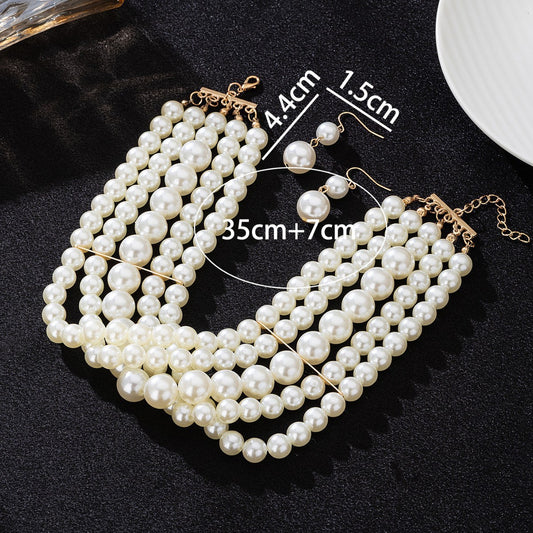 White multi-strand pearl-style choker with matching drop earrings