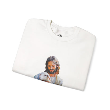 Folded white Christian sweatshirt with peaceful Jesus artwork holding a lamb