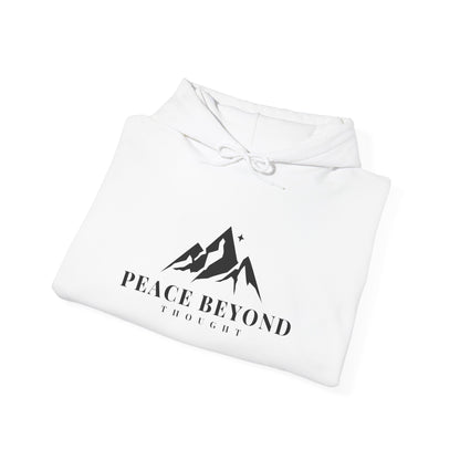 White hoodie with mountain graphic and 'Peace Beyond Thought' text, folded on white background